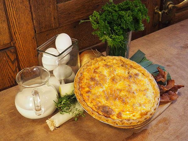 Golden quiche set with leeks, eggs, bacon and other ingredients for breakfast at the Old Consulate Inn